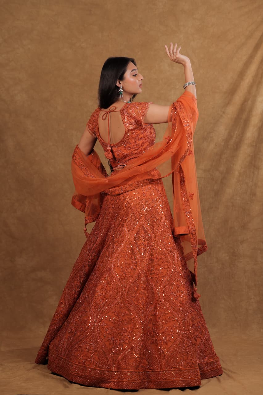 Rust Netted Chaniya Choli with Pearl, Sequence & Diamond Work